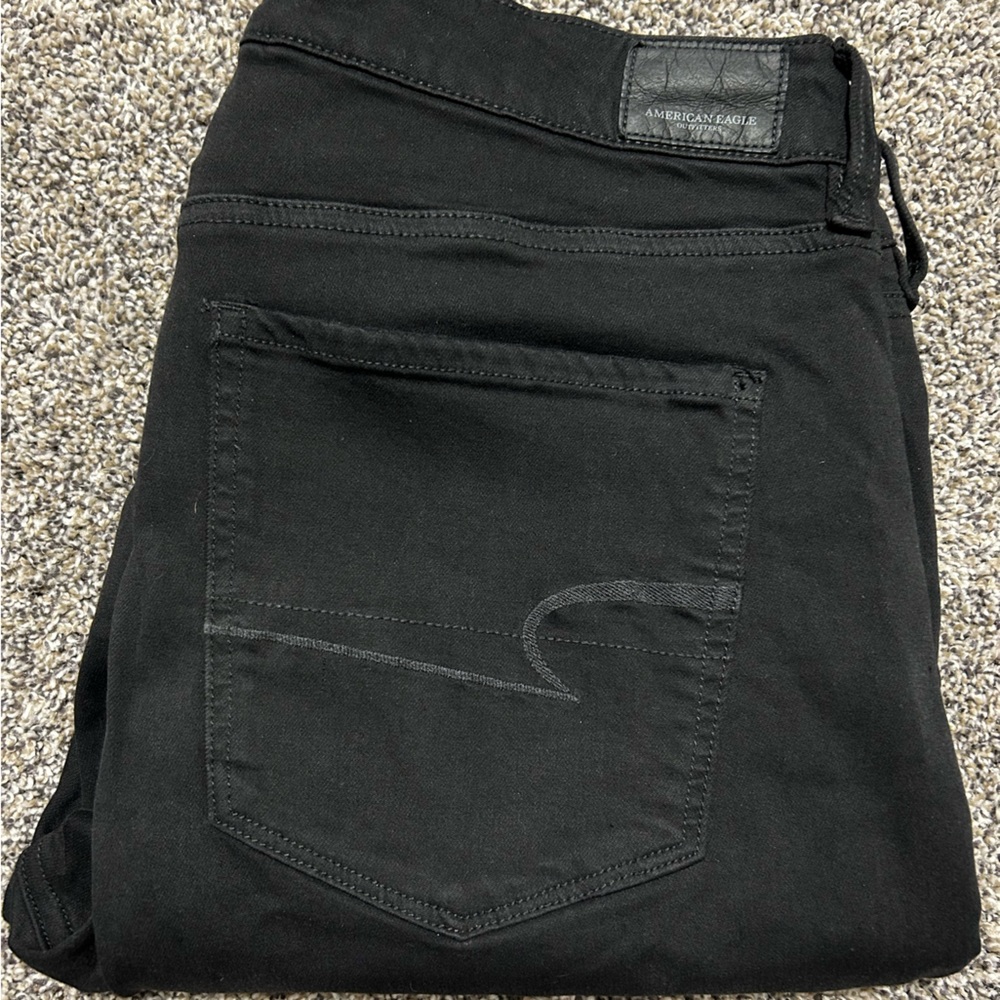 AMERICAN EAGLE OUTFITTERS Super Stretch X distressed jeans.